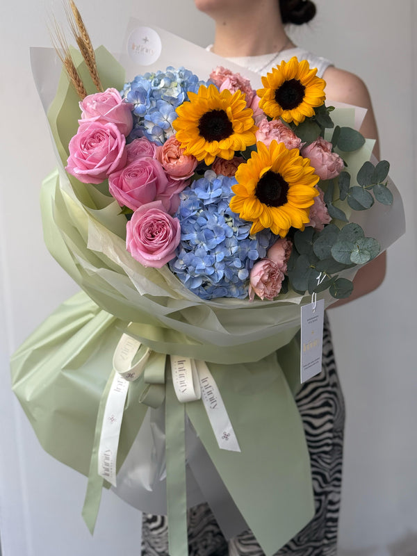 Flower bouquet "Sunny Blues" with helianthus, hydrangea and peony rose