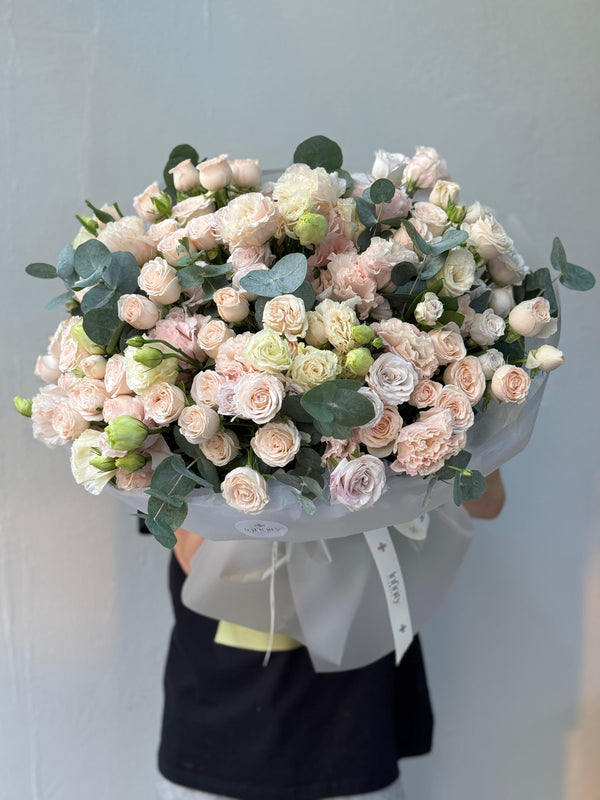 Flower bouquet "Petals of Joy" with lisianthus, spray rose and eucalyptus