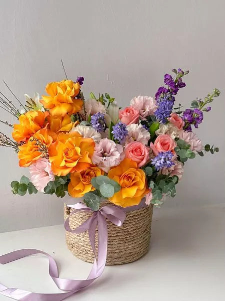 Flower bouquet "Orange sunset" with hyacinth, lisianthus and rose